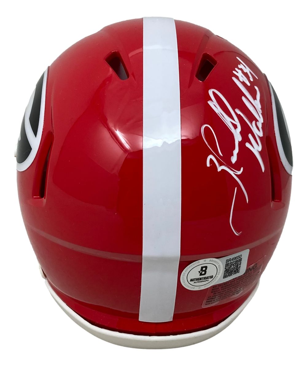 A Herschel Walker signed Georgia Bulldogs Mini Speed Helmet by Sports Integrity, featuring white signatures and large black-and-white logos. Includes an authentication sticker on the back. 82 Heisman BAS.