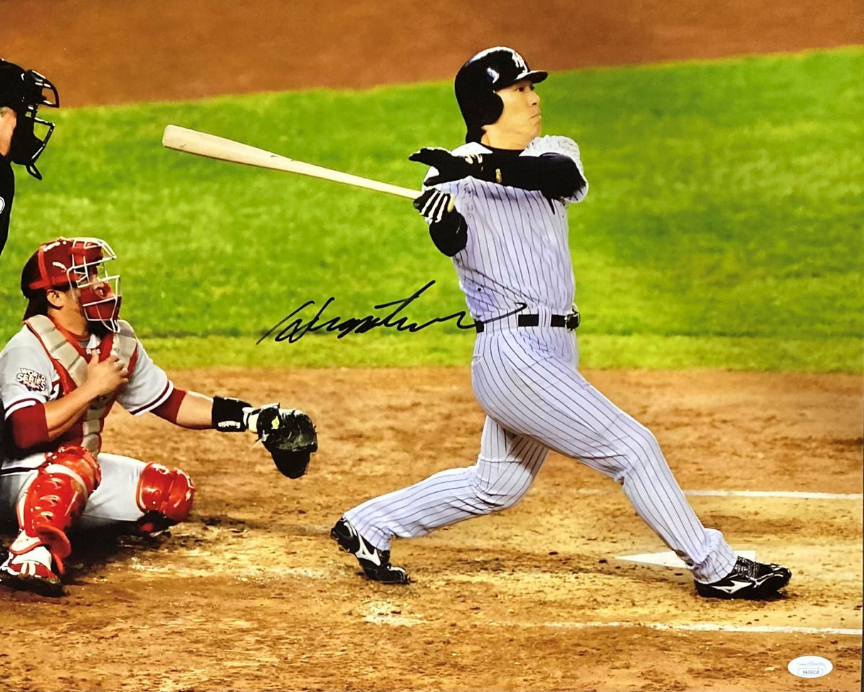 A powerful Hideki Matsui swing in pinstripes is captured in this Sports Integrity 16x20 Yankees 2009 World Series photo, signed boldly across his body and authenticated by JSA. The catcher in red and umpire watch from behind the plate.