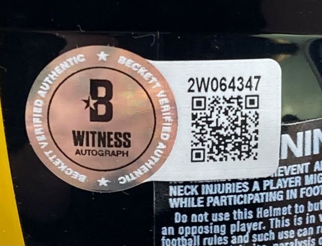 A Beckett Witness Autograph sticker and QR code with serial number 2W064347 are affixed to the Hines Ward Signed Pittsburgh Steelers Mini Speed Replica Helmet BAS w/ Case by Sports Integrity, partially covering printed warning text.