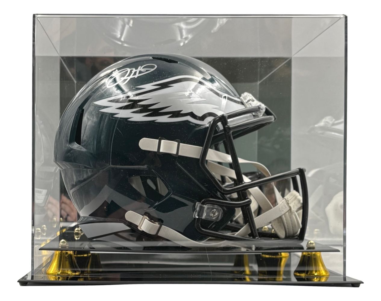 The Sports Integrity Jalen Hurts Signed Philadelphia Eagles FS Speed Replica Helmet comes in a clear acrylic Fanatics case with gold and black supports, featuring the team’s wing logo and a visible autograph on top.