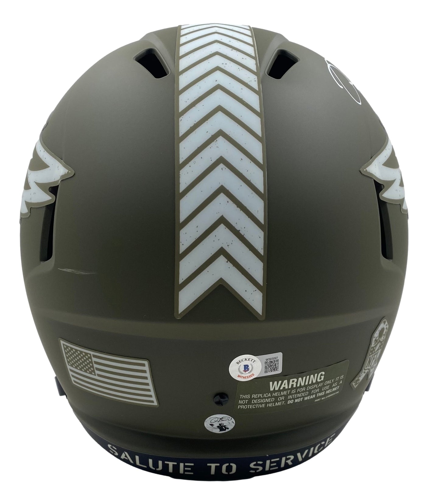 The Sports Integrity Jalen Hurts Signed Eagles FS Salute To Service Speed Replica Helmet BAS+Hurts features a matte army green finish, chevron stripes, American flag decal, warning label, and "SALUTE TO SERVICE" on the lower edge.