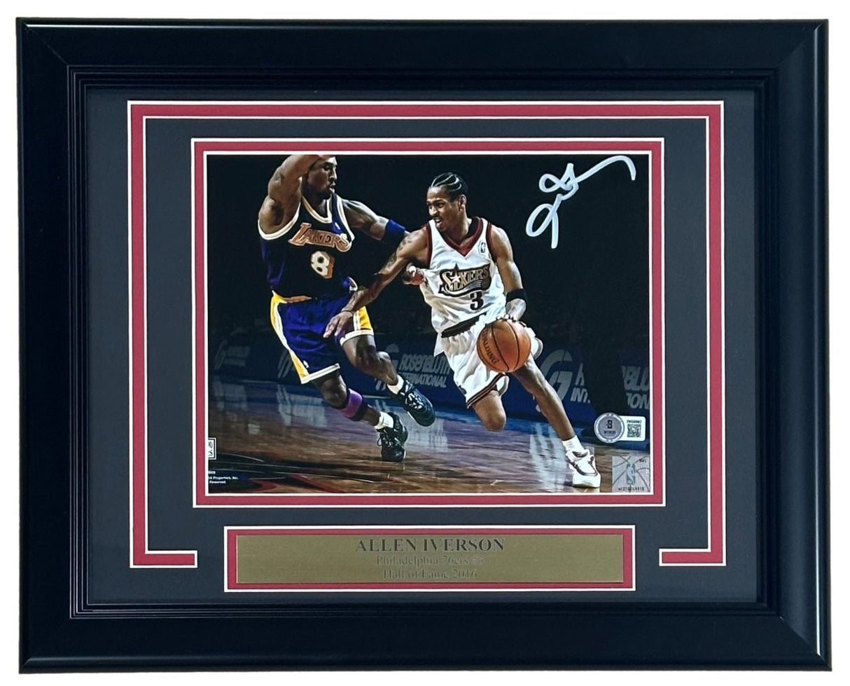 The Sports Integrity Allen Iverson Signed Framed 8x10 Philadelphia 76ers vs Kobe Bryant Photo features Iverson dribbling, his white signature at the top right, and includes a gold name plaque. Authenticated by BAS.