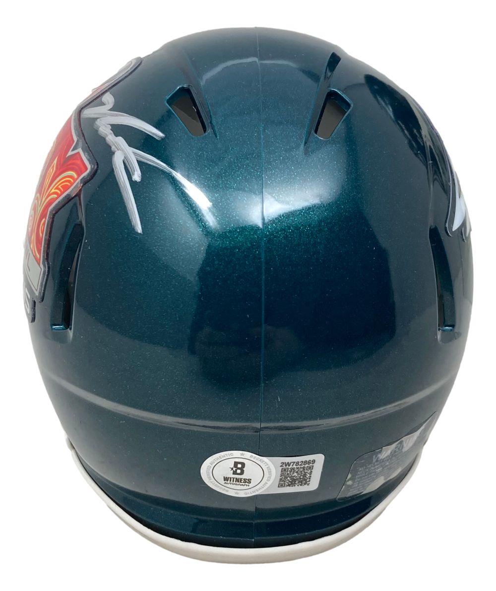 A shiny teal Jalen Carter-signed Philadelphia Eagles Super Bowl 59 mini speed helmet by Sports Integrity, shown from the back with a white autograph, side team logos, two vents, and an authenticity sticker with QR code at the base.
