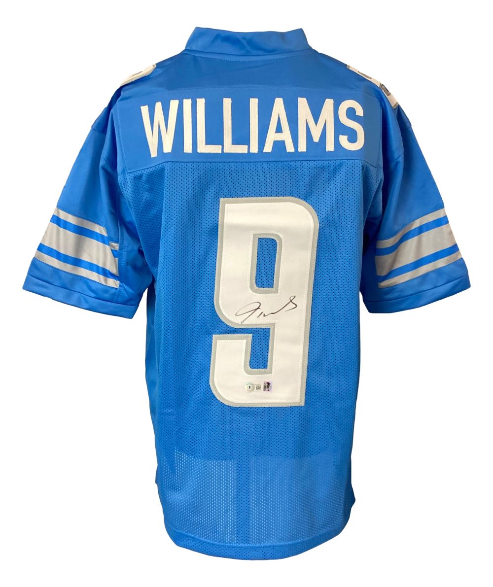 The Sports Integrity Jameson Williams Detroit Signed Light Blue Football Jersey BAS features WILLIAMS and number 9 in white on the back, with Jameson's signature on the number.