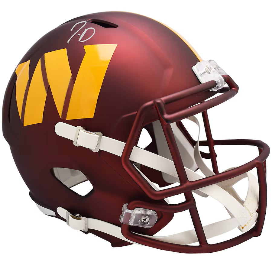 The Jayden Daniels Signed Washington Commanders FS Replica Speed Helmet by Sports Integrity features a maroon shell, large yellow W, white chin straps, and a signature on top.
