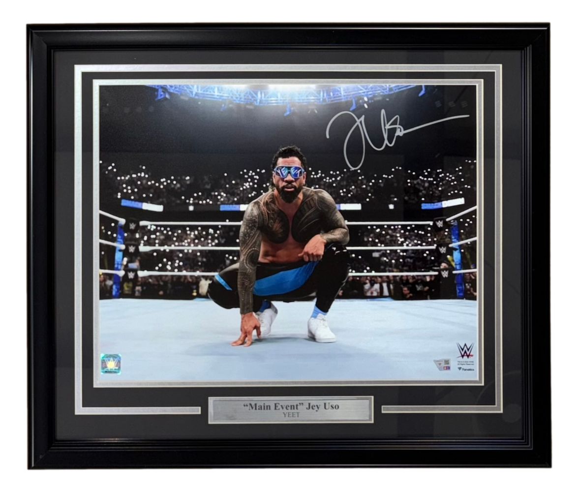 The Sports Integrity Jey Uso Signed Framed 16x20 WWE Photo by Fanatics features Jey Uso kneeling in the ring, backed by a cheering crowd and arena lights, with a nameplate and WWE logo displayed below.