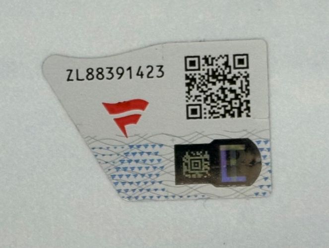 A Sports Integrity Jey Uso Signed Framed 16x20 WWE Photo from Fanatics with a red security sticker featuring serial number ZL88391423, two QR codes, and a holographic patch on a white background.