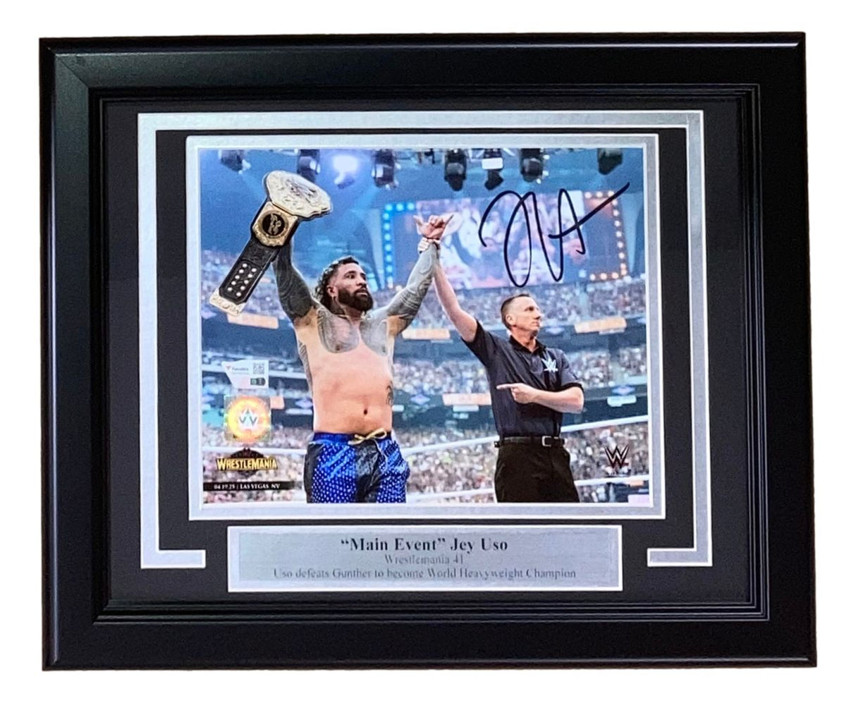 The Sports Integrity Jey Uso Signed Framed 8x10 WWE WrestleMania 41 Photo by Fanatics features Jey Uso celebrating his title win, with an official raising his arm, and includes his signature plus a "'Main Event' Jey Uso, WrestleMania 41" plaque.