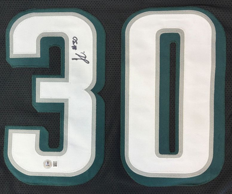 The Jihaad Campbell Philadelphia Signed Black Football Jersey by Sports Integrity features a bold number 30, autographed with signature and #30 in black marker on the left side. Authenticated by BAS.