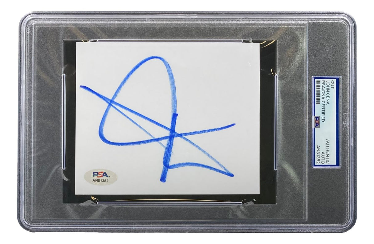 The John Cena Signed Slabbed WWE Cut Signature (PSA AN81382) by Sports Integrity features a white card with a bold blue autograph, sealed in a clear PSA case showing authentication details on the side label.