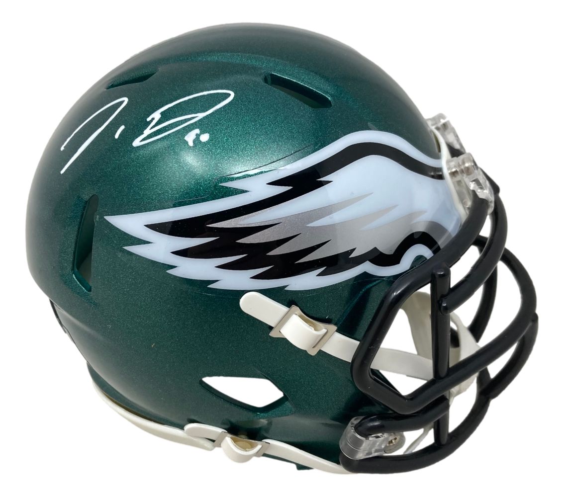 A Jordan Davis signed Philadelphia Eagles mini speed helmet by Sports Integrity, green with a white and silver wing logo and a white signature on top.