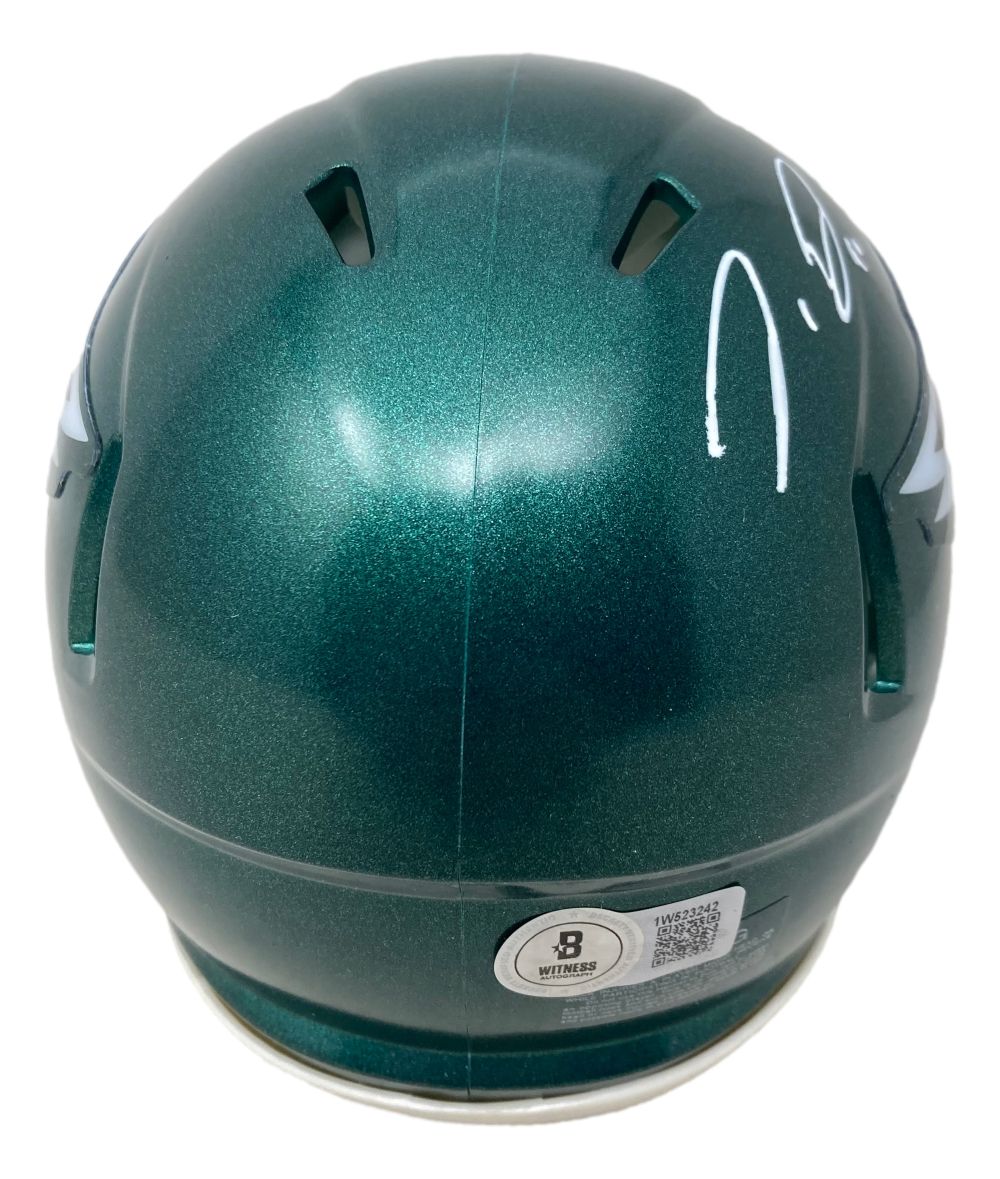 A Jordan Davis signed Philadelphia Eagles Mini Speed Helmet by Sports Integrity features a green back view, silver eagle wing graphics, white signature on top, and BAS certification sticker near the bottom.