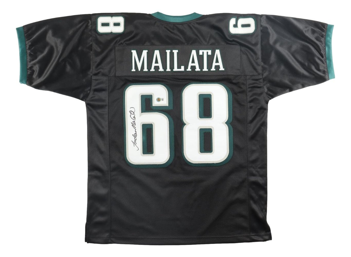 The Sports Integrity Jordan Mailata Philadelphia Signed Black Football Jersey BAS features Mailata's name and #68 in large white print with green-accented numbers and sleeve trim, plus his signature on the left side of the number.