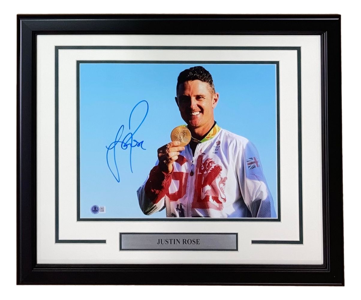 Sports Integrity Justin Rose Signed Framed 11x14 PGA Golf Photo BAS features an autographed photo of Justin Rose smiling in a Team GB jacket, holding a medal, with a nameplate reading JUSTIN ROSE.