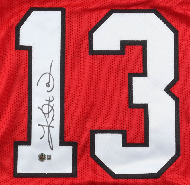 Kurt Warner Arizona Signed Red Pro-Cut Football Jersey by Sports Integrity features a large white number 13 outlined in black, hand-signed in black marker on the left, with a BAS authenticity sticker below the signature.