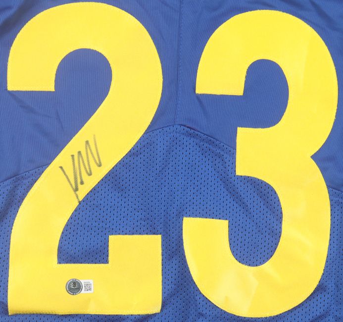 The Sports Integrity Kyren Williams Los Angeles Signed Blue Pro-Cut Football Jersey features large yellow 23 on the back, a black marker signature on the left side of the "2," and a small circular authentication sticker below the number.