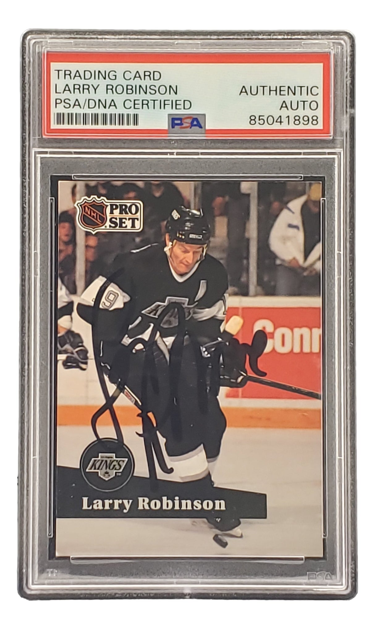 The Sports Integrity Larry Robinson Signed 1991 Pro Set #104 LA Kings Hockey Card is PSA/DNA authenticated and features him in a black uniform skating with a hockey stick.