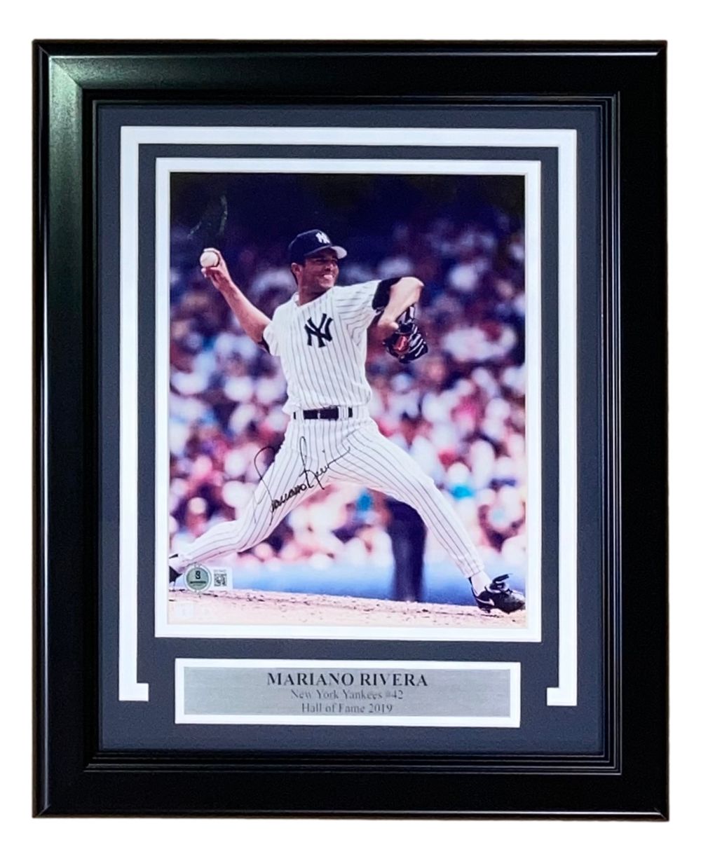Sports Integrity Mariano Rivera Signed Framed 8x10 New York Yankees Photo BAS features Rivera mid-pitch in uniform, autograph visible, with a plaque noting “Mariano Rivera New York Yankees #42 Hall of Fame 2019.”.