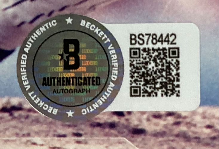 A Beckett Verified sticker with holographic text, circular border, QR code, and serial BS78442 is on the Sports Integrity Mariano Rivera Signed Framed 8x10 New York Yankees Photo BAS.