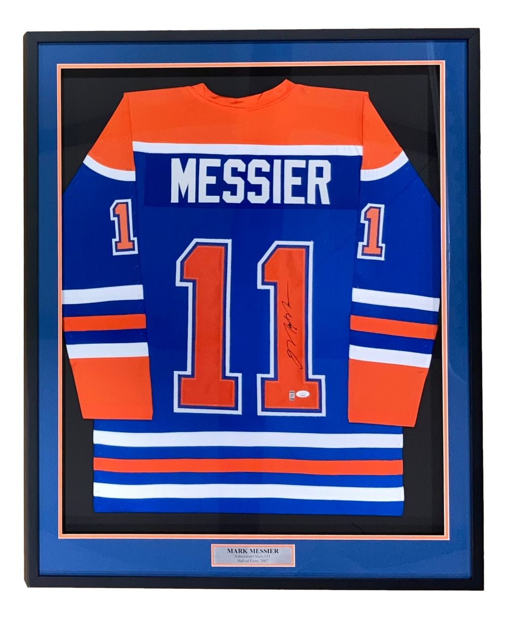 The Sports Integrity Mark Messier Edmonton Signed Framed Blue Hockey Jersey JSA features Messier's name and #11, a signature, and a nameplate, all professionally mounted in a black display frame.