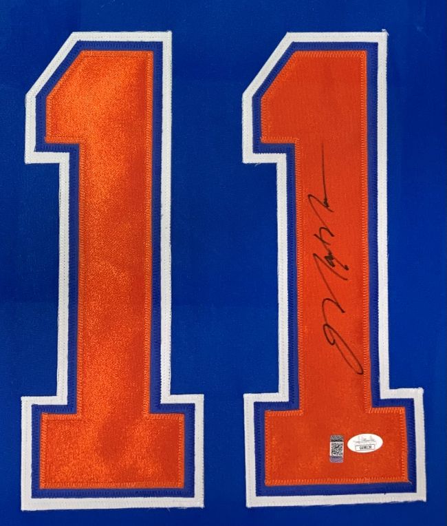The Sports Integrity Mark Messier Edmonton Signed Framed Blue Hockey Jersey features orange number 11 outlined in white, a black signature on the right digit, and two authentication stickers at the bottom right.