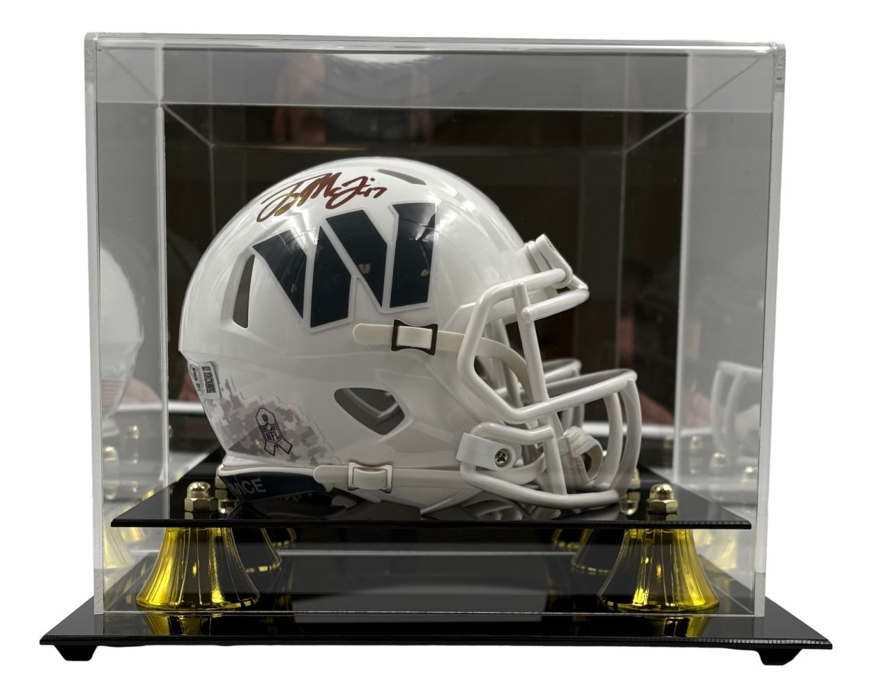 The Sports Integrity Terry McLaurin Signed Commanders Salute Service Mini Speed Helmet is showcased in a clear acrylic display case with a black base and gold accents.