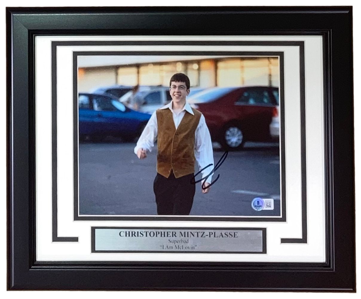 Christopher Mintz-Plasse Signed Framed 8x10 Superbad McLovin Photo by Sports Integrity, featuring him as McLovin smiling and walking in a parking lot, includes a nameplate and quote “I am McLovin.”.