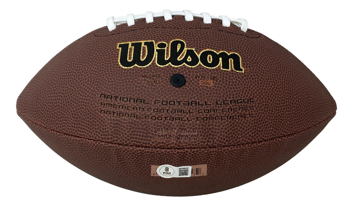 A Sports Integrity Michael Vick Atlanta Falcons Signed NFL Wilson Super Grip football featuring white laces, brown textured surface, black and gold logo, and text referencing the National and American Football Conferences.
