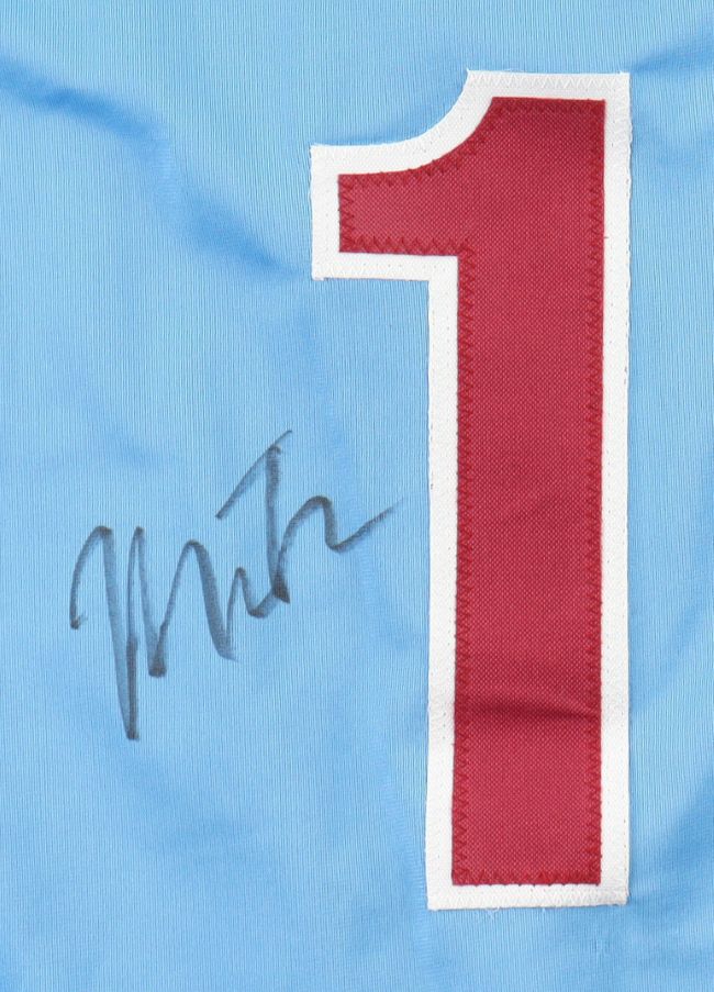 The Miles Teller Philadelphia Signed Light Blue Baseball Jersey by Sports Integrity features a large red and white number 1 on light blue fabric, with a black autograph overlapping the left side of the number.
