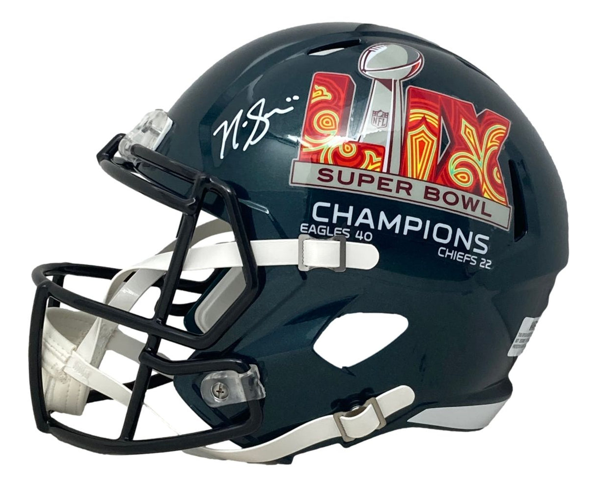 The Sports Integrity Nick Sirianni Signed Philadelphia Eagles FS Super Bowl LIX Replica Helmet features a facemask, CHAMPIONS text, and score details, with a white signature above the SB59 logo.