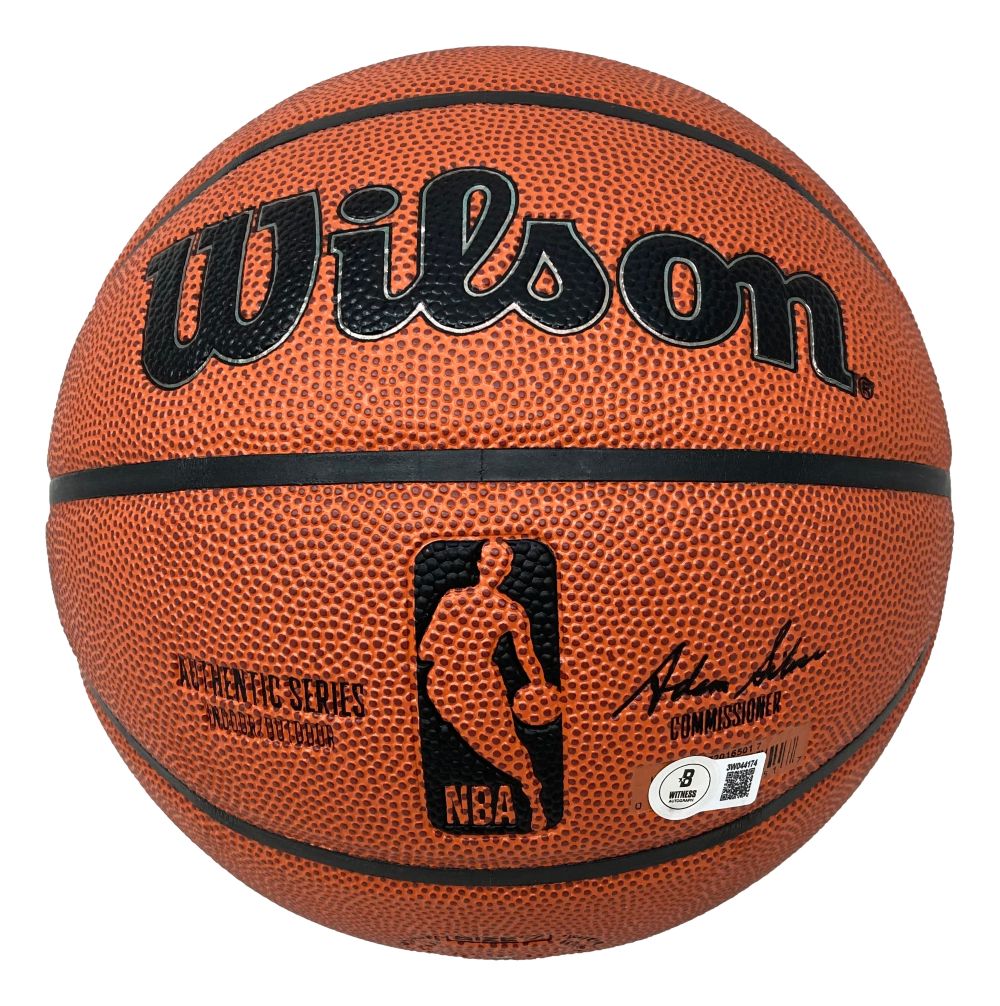 The Sports Integrity Patrick Ewing New York Knicks Signed NBA Wilson I/O Basketball features a textured orange surface, black lines, the NBA logo, product details, and Patrick Ewing's signature.