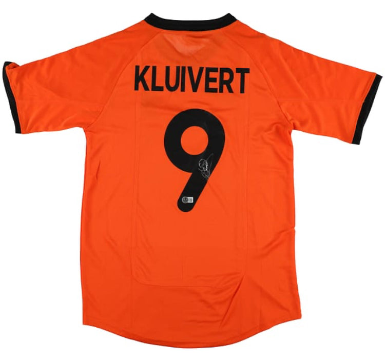 The Patrick Kluivert Signed Netherlands Nike Soccer Jersey by Sports Integrity features Kluivert’s name and number 9, with orange fabric and black trim.