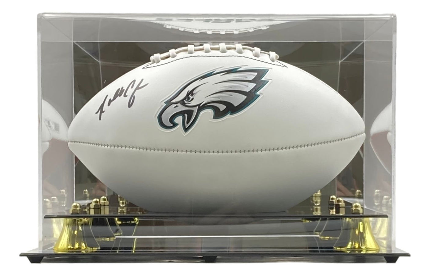 The Sports Integrity Randall Cunningham Signed Philadelphia Eagles Logo Football comes in a clear acrylic display case with gold supports.