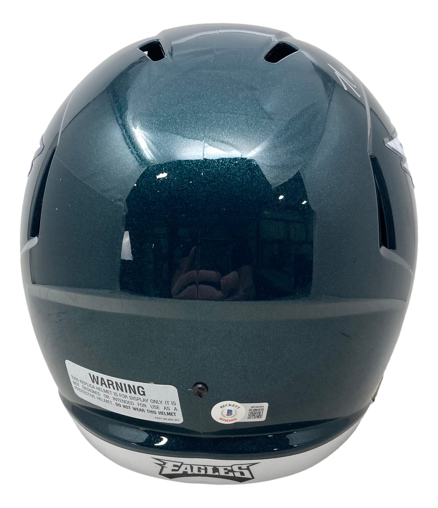 The Randall Cunningham Signed Philadelphia Eagles FS Speed Replica Helmet by Sports Integrity is a glossy, dark green helmet featuring a white warning label, certification sticker, and "EAGLES" on the lower edge.