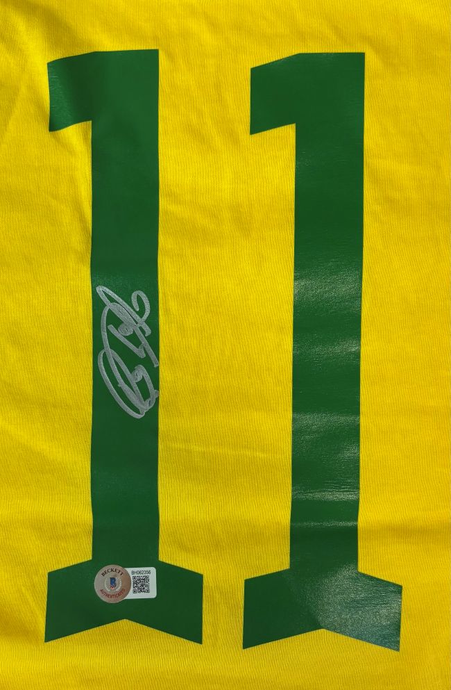 The Sports Integrity Raphina Brazil Signed Yellow Soccer Jersey features a green number 11, with the left digit autographed in white and a small BAS holographic authenticity sticker at its bottom left.
