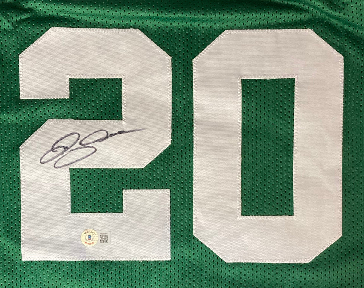 The Ray Allen Boston Signed Green Basketball Jersey by Sports Integrity features a bold white number 20, signed in black marker on the left side of the "2," with an authentication sticker near the number’s bottom.