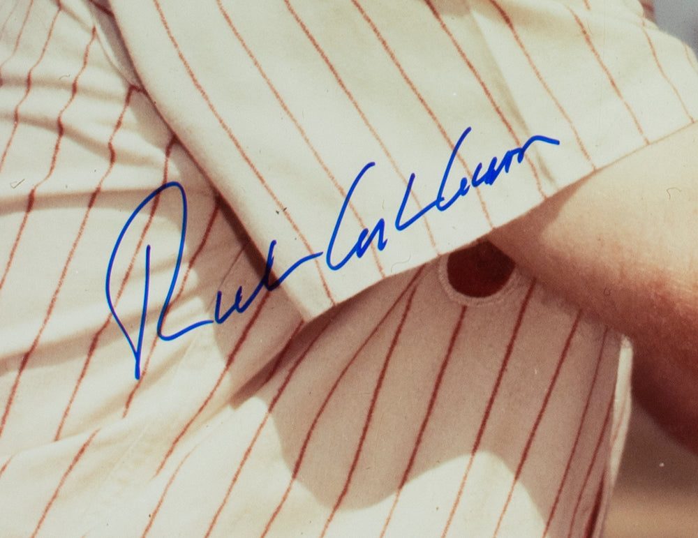 A blue autograph is visible on a 16x20 Philadelphia Phillies baseball photo signed by Richie Ashburn and authenticated by PSA/DNA. Offered by Sports Integrity, the signature stands out against the fabric in the image.