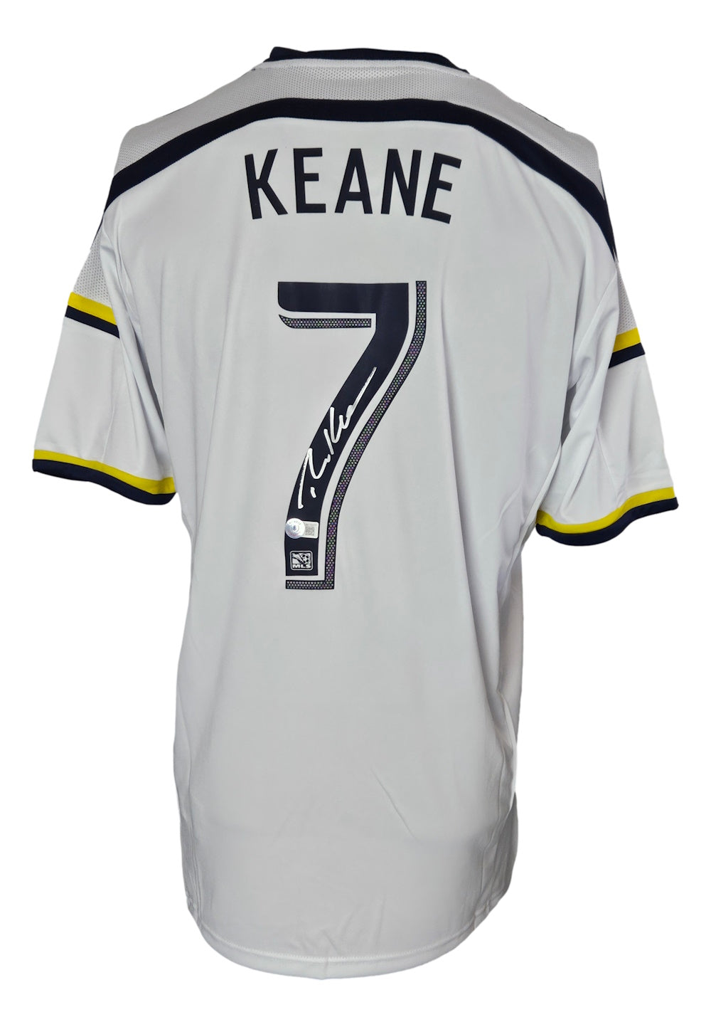 This Robbie Keane Signed Los Angeles Galaxy Adidas Soccer Jersey by Sports Integrity features KEANE and number 7 on the back with a signature on the number, plus black and yellow sleeve accents.