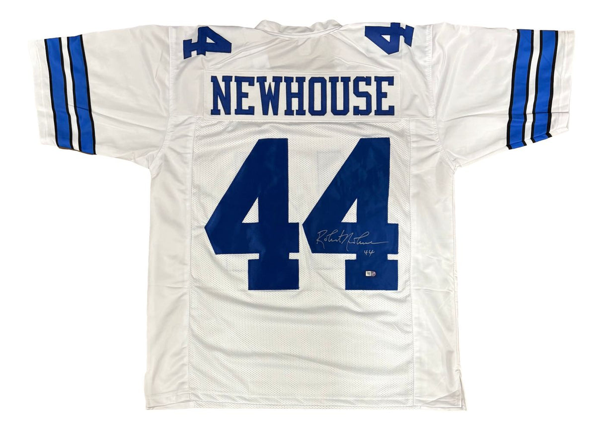 The Sports Integrity Robert Newhouse Dallas signed white football jersey features blue sleeve stripes, "NEWHOUSE" above the number 44 on the back, and a white ink signature on the number.