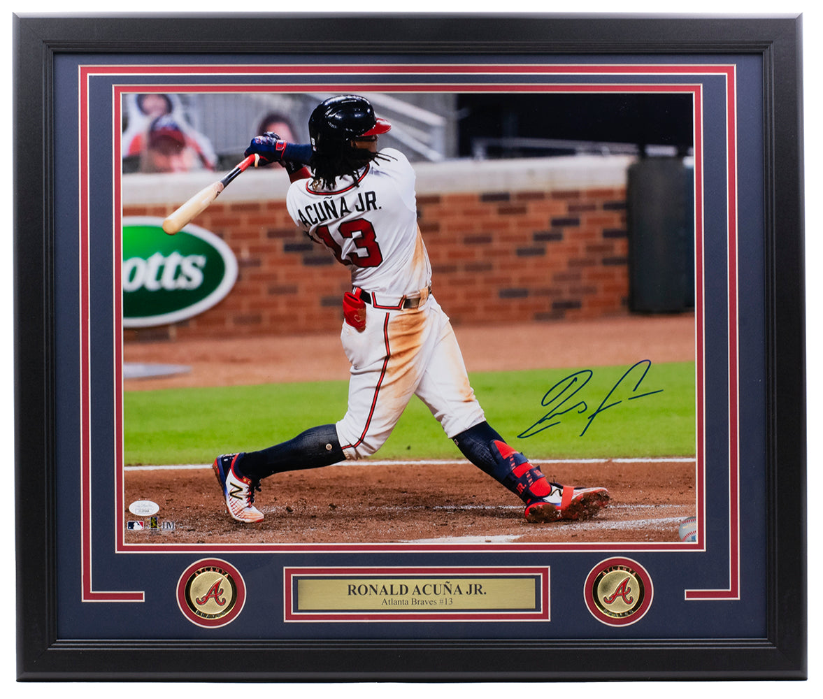 Sports Integrity Ronald Acuna Jr. Signed Framed 16x20 Atlanta Braves Photo JSA—features Acuna in a white Braves uniform with #13, swinging a bat and signing in blue ink; includes plaque: RONALD ACUÑA JR. Atlanta Braves #13.
