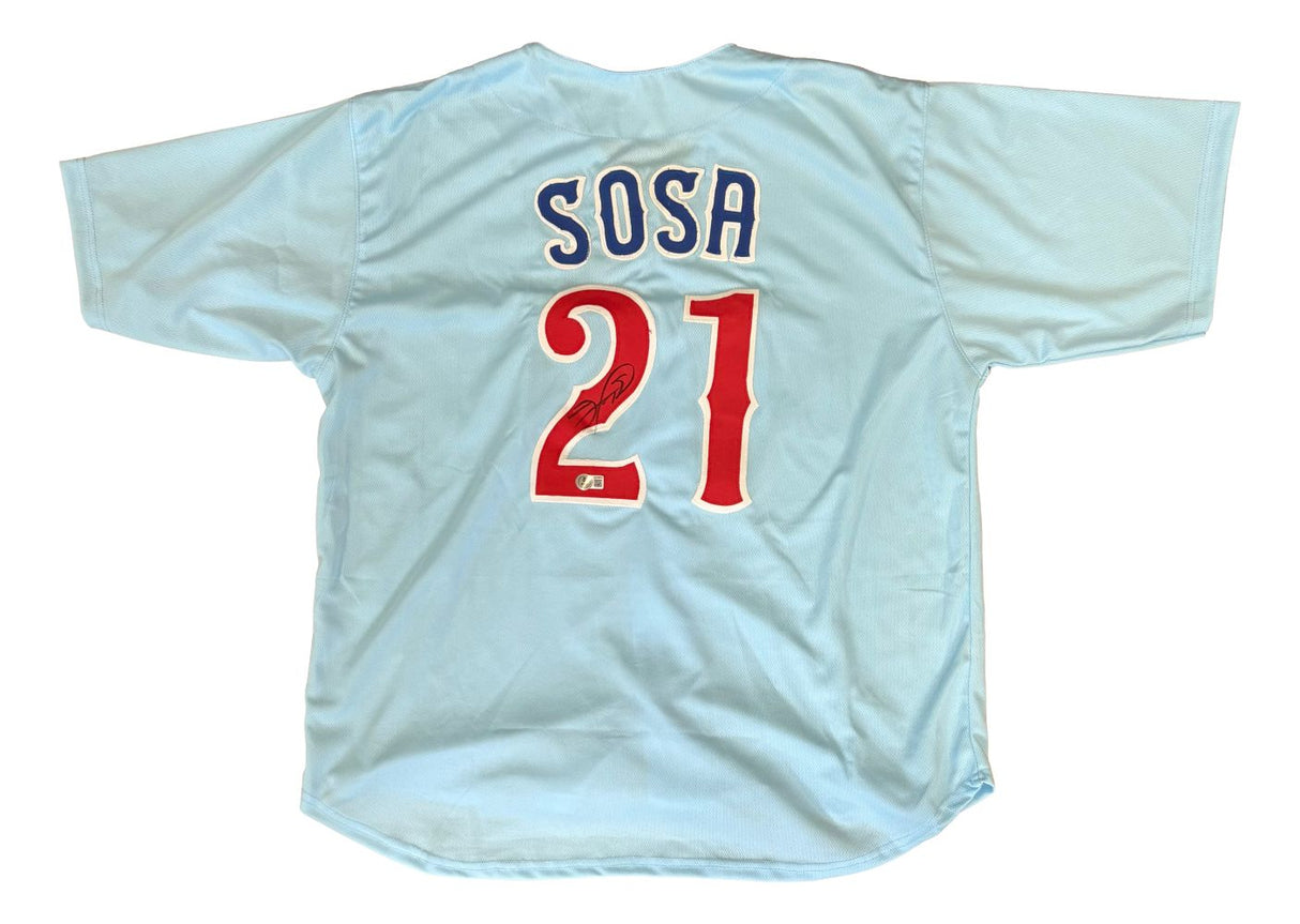 The Sports Integrity Sammy Sosa Chicago Signed Light Blue Baseball Jersey features "SOSA" and the number 21 in red and white on the back, authenticated by BAS.