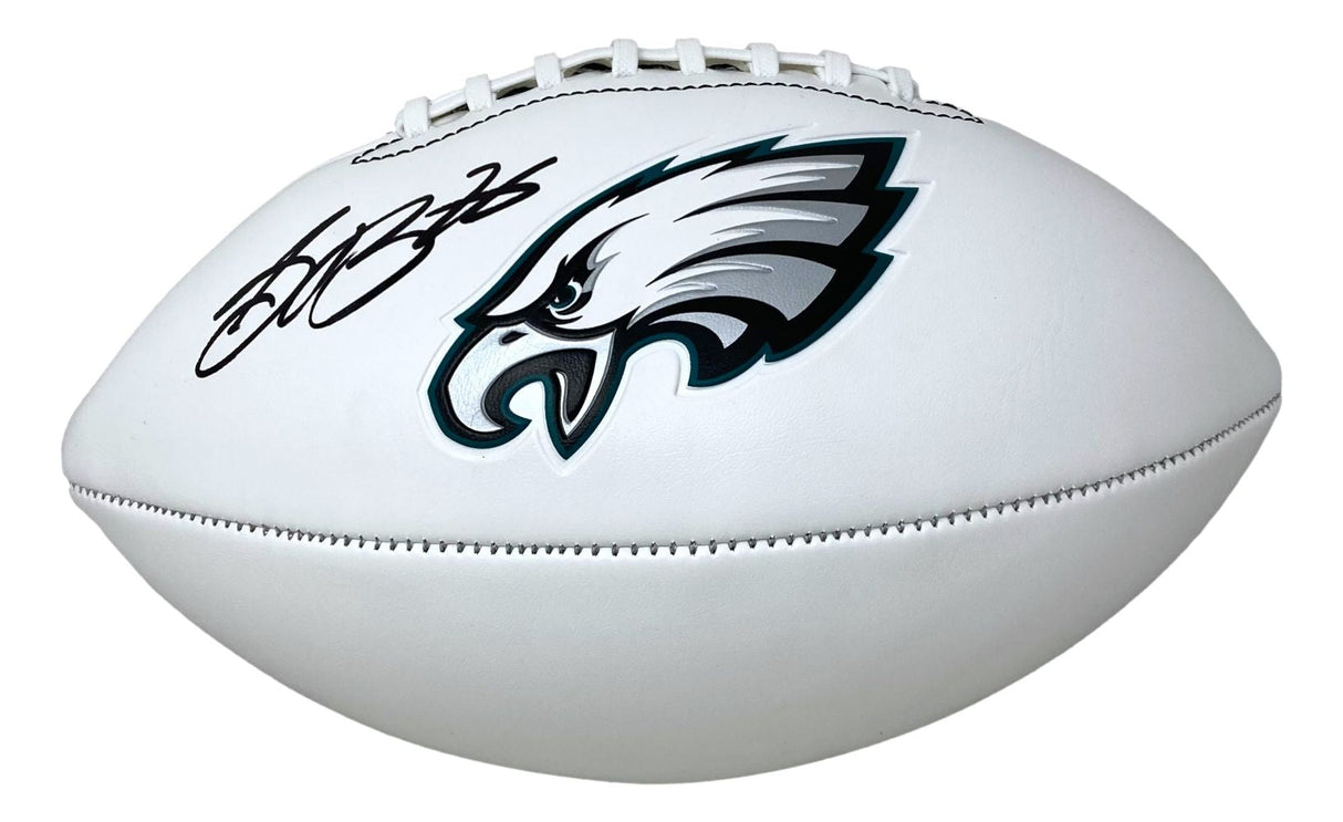 A Saquon Barkley signed Philadelphia Eagles logo football by Sports Integrity, authenticated by PSA/DNA, featuring a black signature on the white surface.
