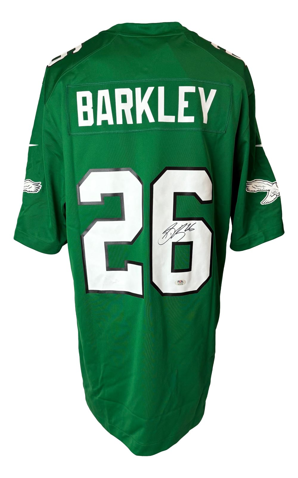 The Sports Integrity Saquon Barkley Signed Eagles Kelly Green Nike Game Replica Jersey features BARKLEY and number 26 in white, white and black trim, team logos on the sleeves, and a signature on the 6. PSA/DNA certified.