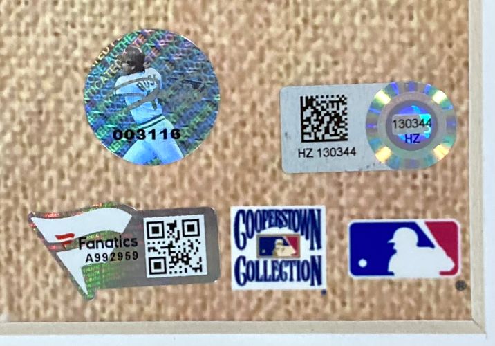 Five authentication and branding stickers on a textured background, including Fanatics, Cooperstown Collection, MLB logos, and two holographic QR code stickers with serial numbers for the Sports Integrity Mike Schmidt Pete Rose Steve Carlton Signed Framed 16x20 Phillies Photo.