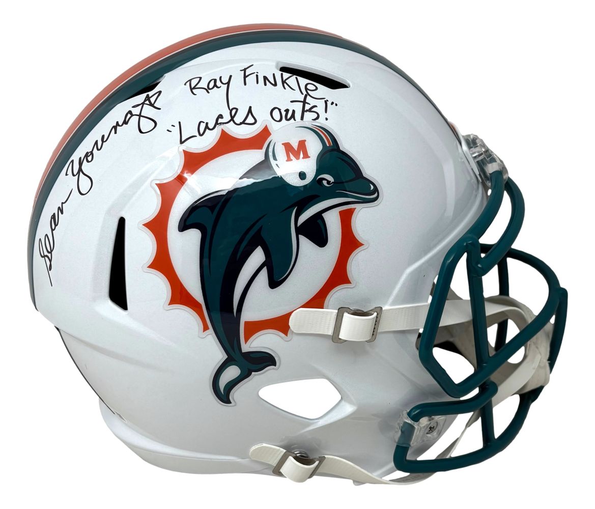 The Sports Integrity Sean Young Ace Ventura Signed Dolphins FS Replica Helmet features "Finkle Laces Out" and an autograph above the faceguard, with a teal dolphin logo. Authenticated by JSA QR.