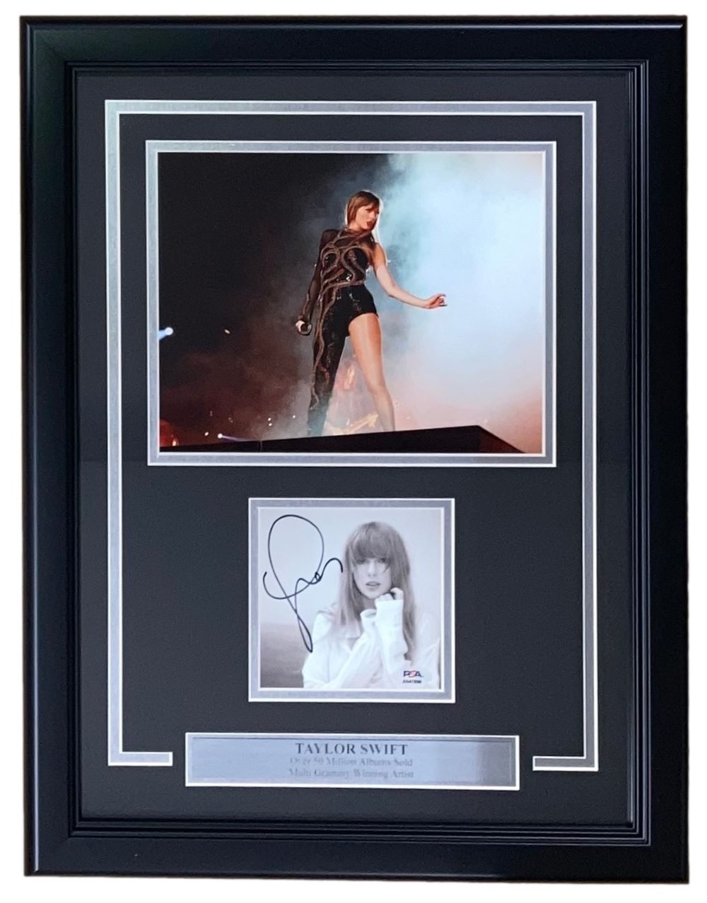 A Sports Integrity framed display featuring a Taylor Swift signed TTPD smoke photograph authenticated by PSA/DNA, and a nameplate identifying her as a multi-Grammy award-winning artist.