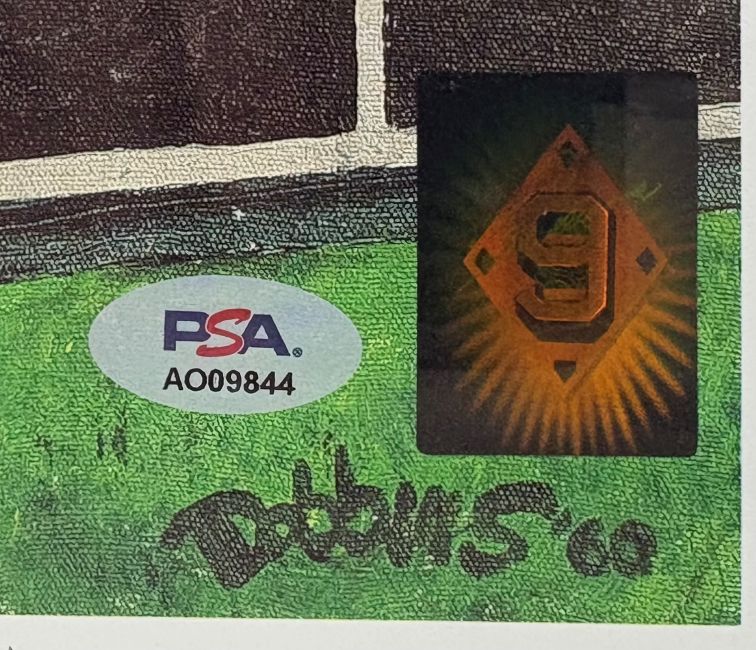 A close-up of the Ted Williams Signed Framed 16x20 Boston Red Sox Photo by Sports Integrity shows his autograph, a PSA/DNA sticker labeled A009844, and a holographic orange "S" sticker on a green and brown background.