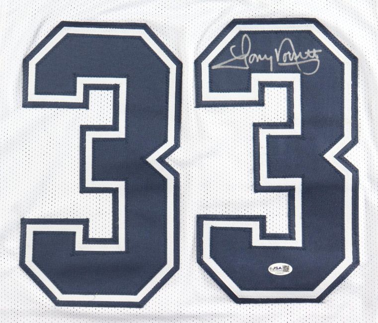 The Sports Integrity Tony Dorsett Dallas Signed Alternate White Football Jersey features large blue 33s, a silver autograph on the upper right of the second 3, and a JSA QR hologram sticker below the numbers for authentication.