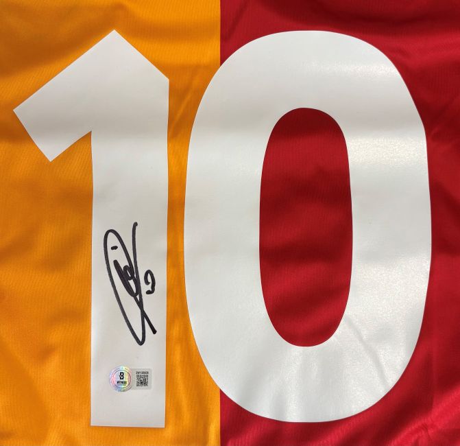 A close-up of a Francesco Totti Signed AS Roma Kappa Soccer Jersey by Sports Integrity, featuring a white number 10 with his signature on the 1 and an authentication sticker at the bottom.