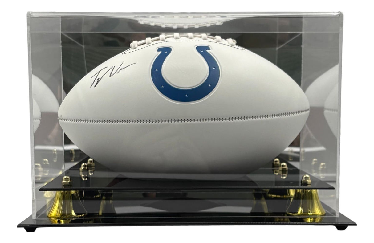 The Tyler Warren Signed Indianapolis Colts Logo Football by Sports Integrity is displayed in a clear case with a black base and gold accents.